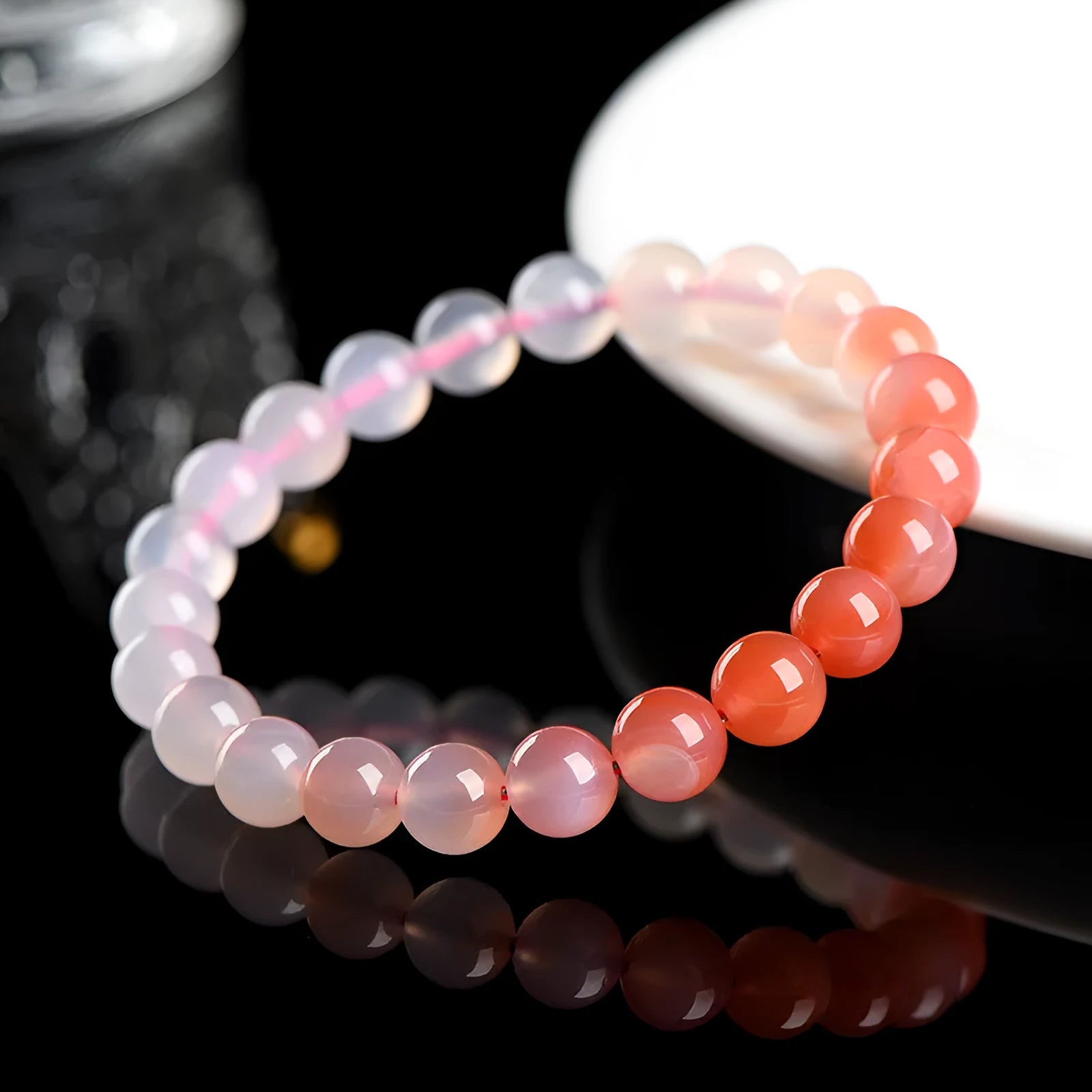Natural gradient Yanyuan agate bracelet with geometric beads in a salt source colour, shown with size options.