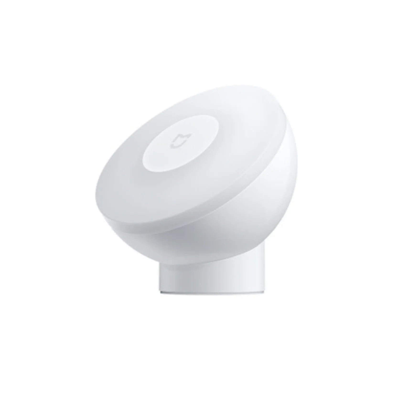 White modern bedside table lamp with human body induction and Bluetooth on a wooden nightstand.