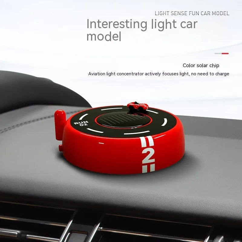 Solar-powered round car-shaped fragrance diffuser with light sensor in black plastic design