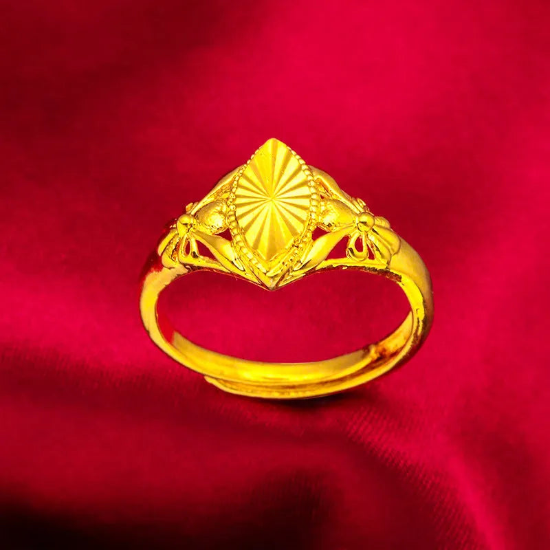 Open geometric flower ring in gold colour with textured details on brass base
