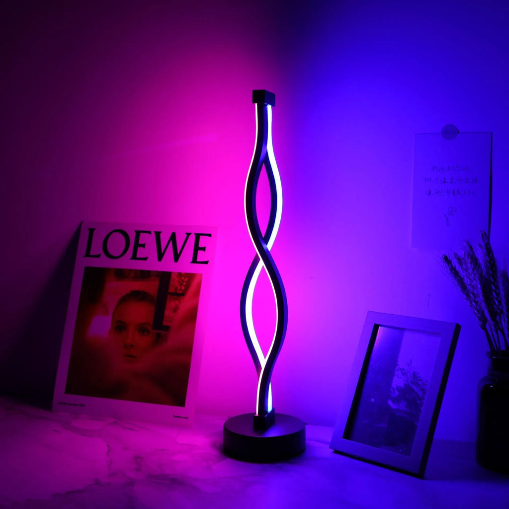 Black aluminium desktop table lamp with dimming button and touch controls.