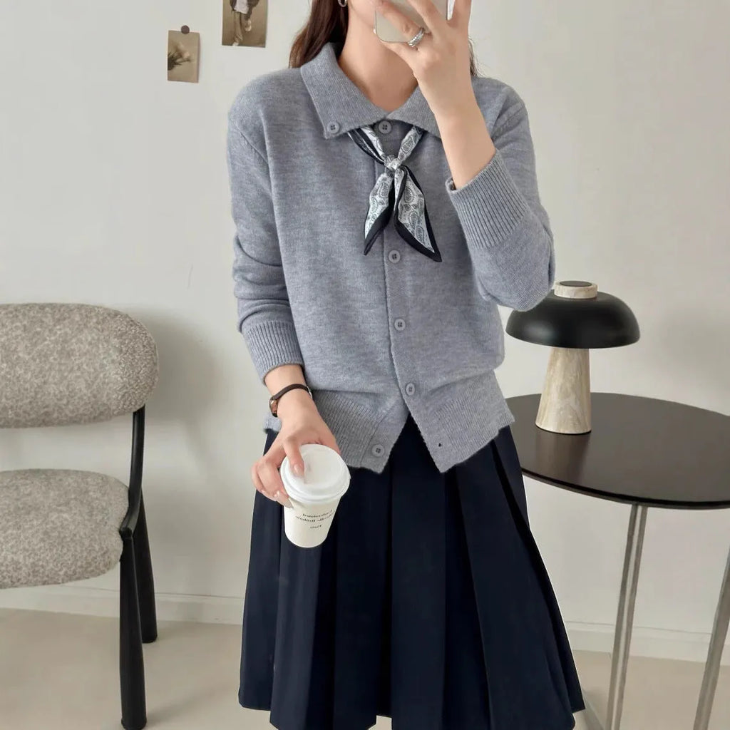 Women's beige cardigan sweater with a built-in lapel scarf collar and long sleeves.