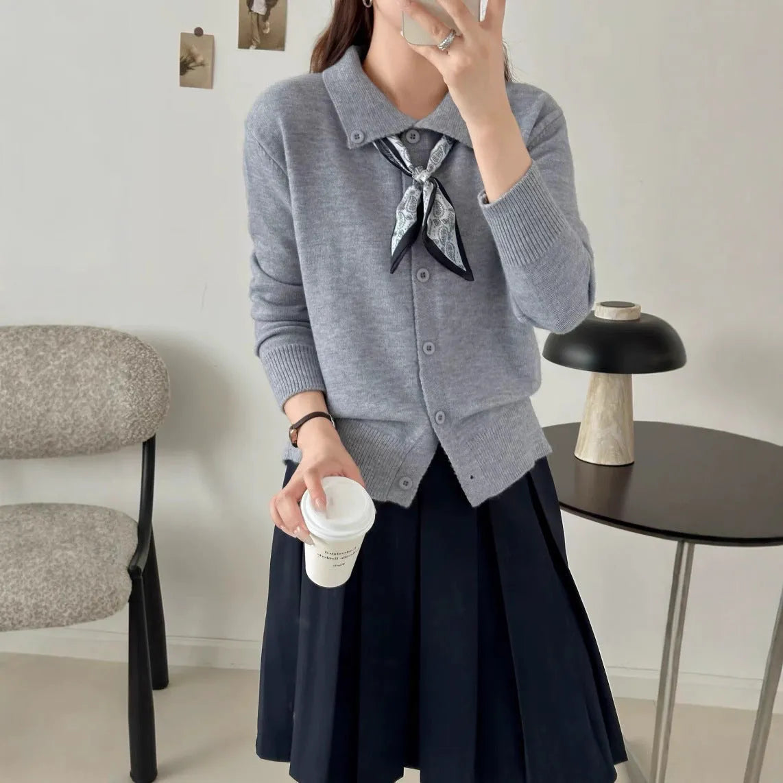 Women's beige cardigan sweater with a built-in lapel scarf collar and long sleeves.