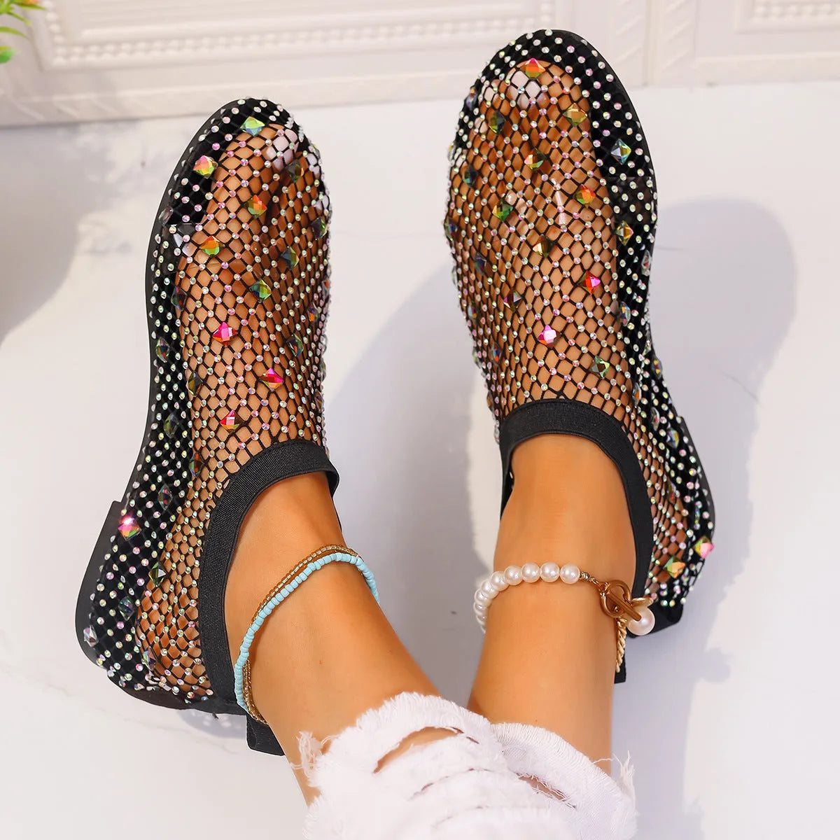 Women's flat mesh sandals with colourful rhinestone decoration on heel strap