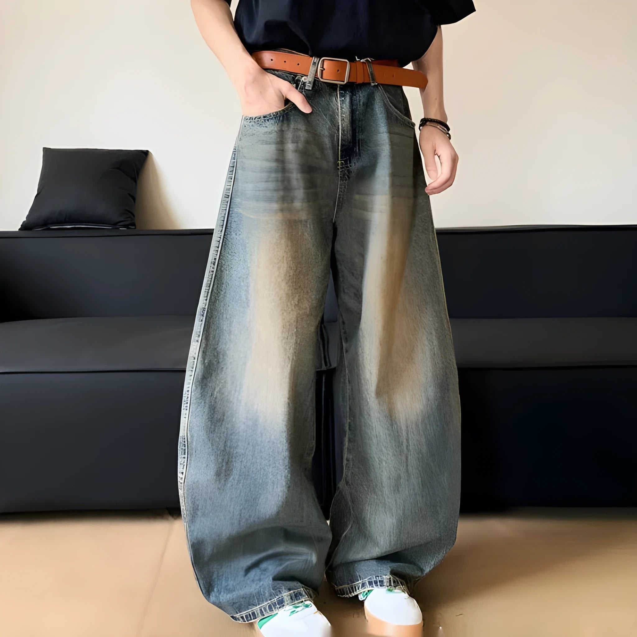 Men's retro blue distressed wide-leg jeans with a slimming fit through hips and thighs.