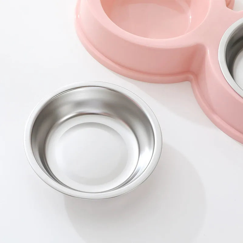 Blue double compartment pet feeding bowl with stainless steel frog-shaped water bowl attached.