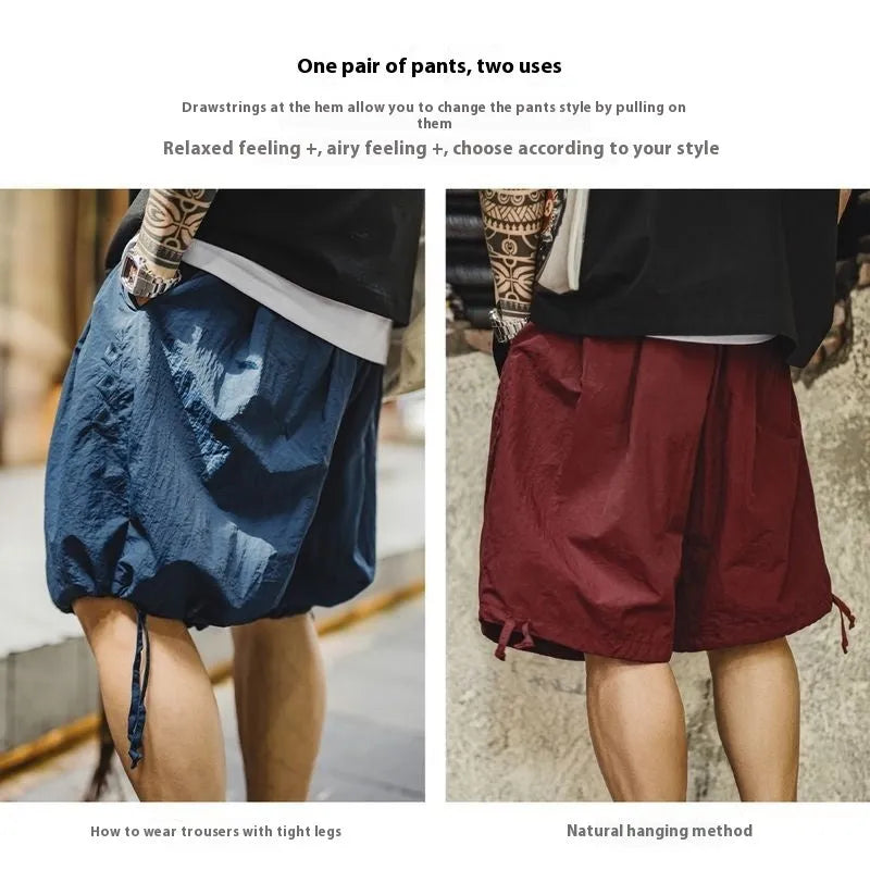 Men's Prussian blue nylon beach shorts with embroidered detail and elastic waistband