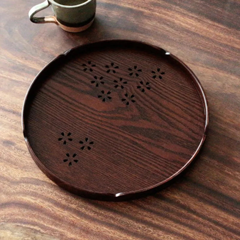 Wooden shallow plate with hollow sakura cherry blossom design, 30 cm diameter, for dessert serving.