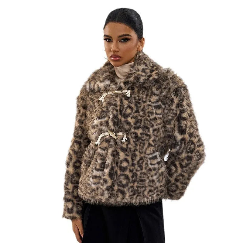 Leopard print women's coat with a buckle lapel fastening and regular sleeves.