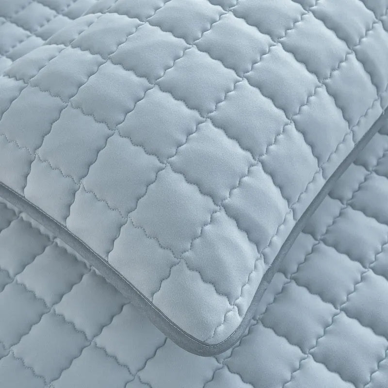 Class A waterproof fitted sheet in blue, shown stretched over a mattress corner.