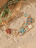Women's alloy bracelet with rhinestone boat anchor charm and starfish detail in turquoise, red, or blue.