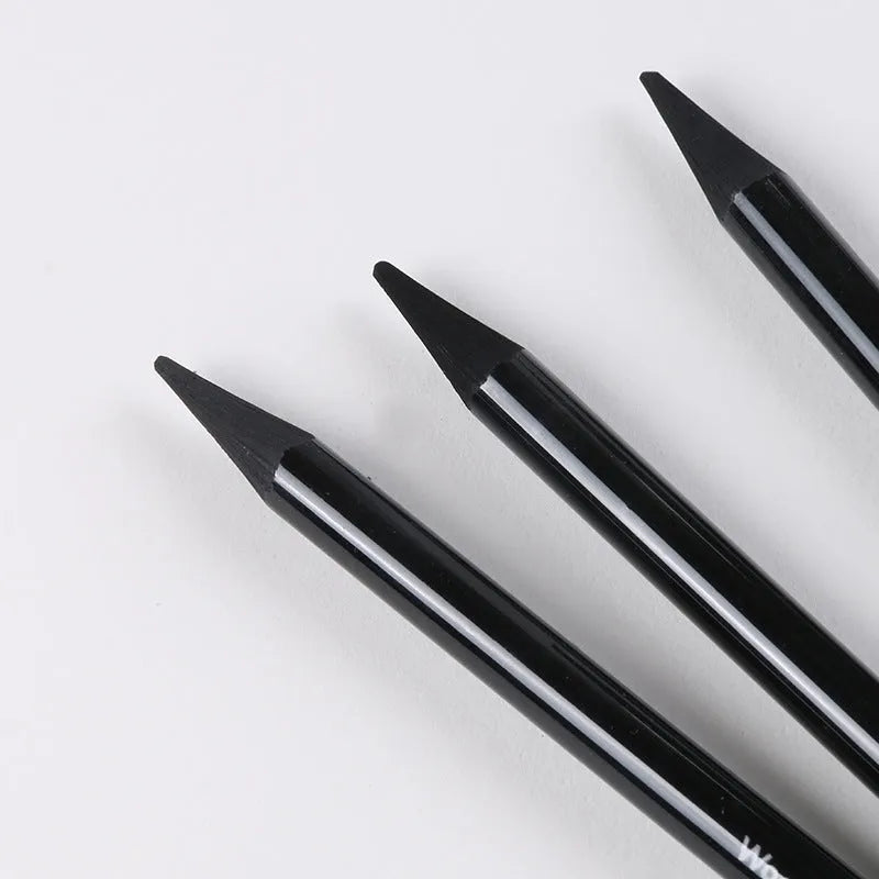 Set of nine graphite and carbonised wooden drawing pencils displayed on a suction card packaging.