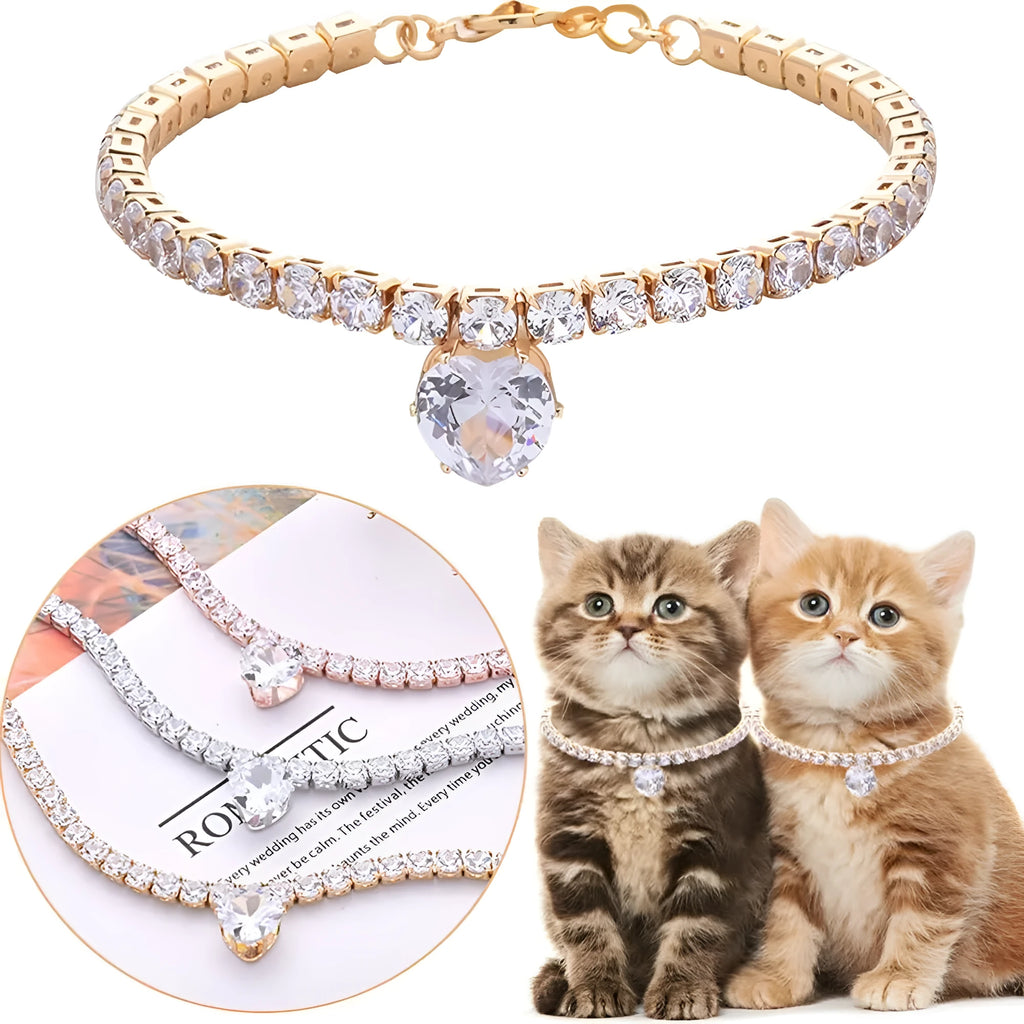 Gold rhinestone heart-shaped decorative collar for a cat or dog on a white background.
