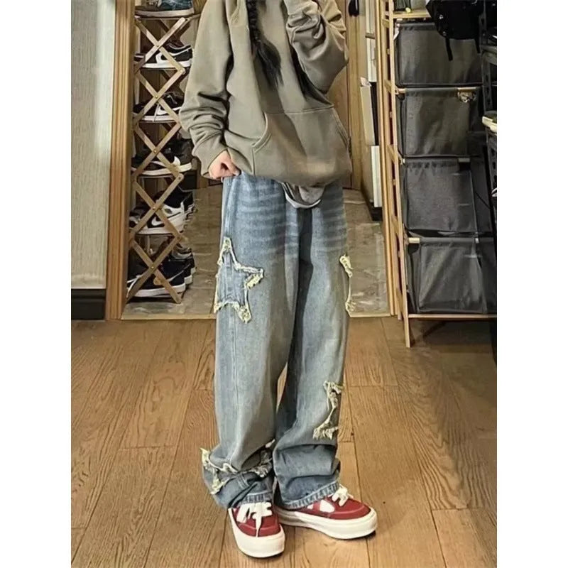 Blue high-waist wide-leg women's jeans on a model, showing the straight-leg cut and denim texture.