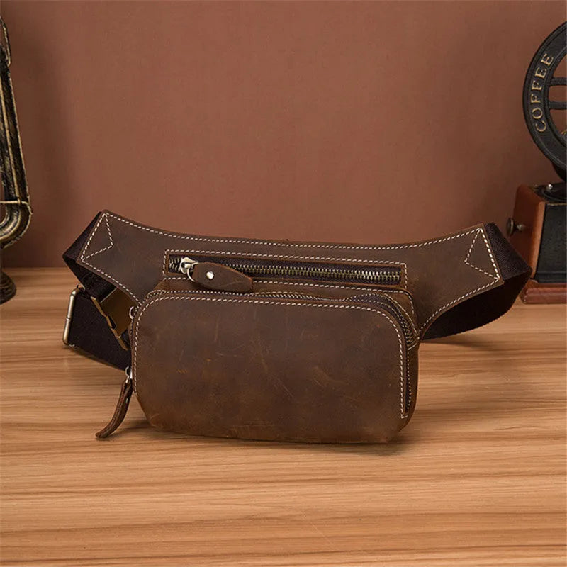 Brown top layer cowhide leather men's sports waist bag with pull closure.