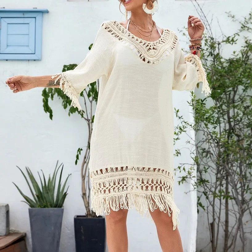 Apricot crocheted patchwork beach dress with mid-length skirt and half sleeves on hanger