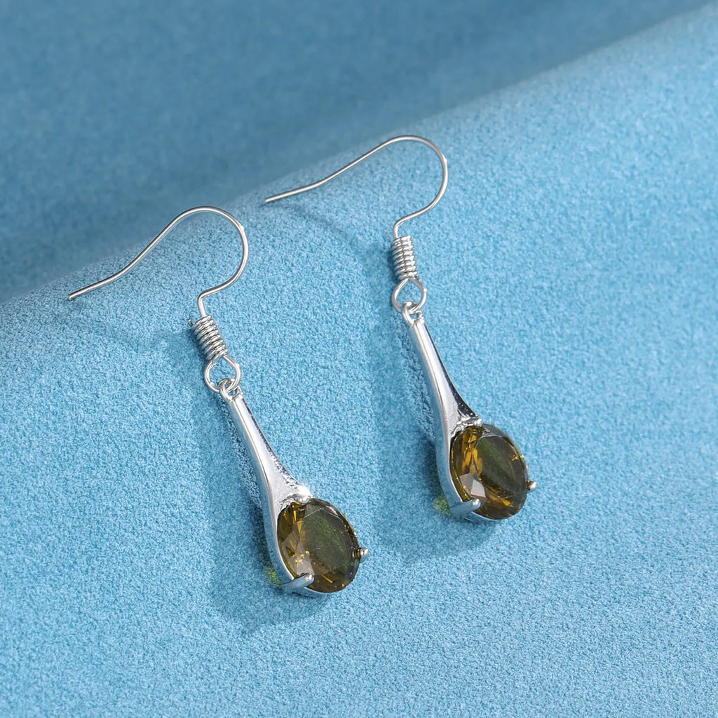 Olive green drop-shaped alloy earrings with posts on a white background.
