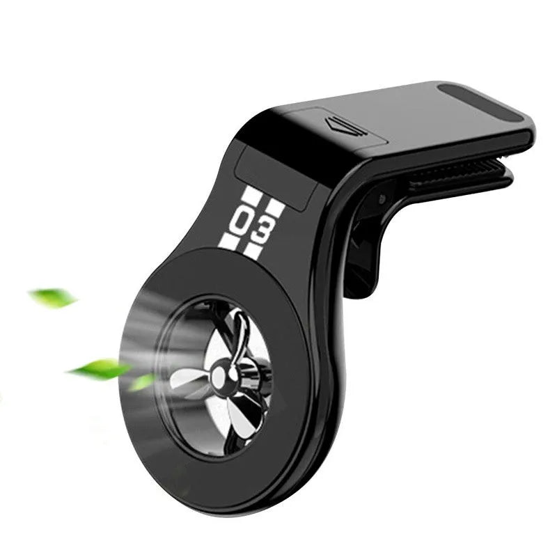 Black magnetic car phone holder attached to car air vent with phone mounted and adjustable rotation