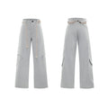 Men's dark blue loose fit straight-leg trousers showing 3D cutting, belt stitching, and tassel details on pockets and zipper.