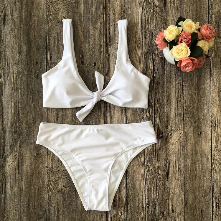 Solid colour polyester bikini swimsuit set on a white background