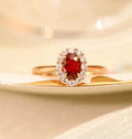 Gold Pigeon red blood gemstone sterling silver inlaid ring with floral pattern on silver-plated metal background