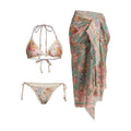 Women's creamy-white floral bikini set with halter top, briefs, and skirt