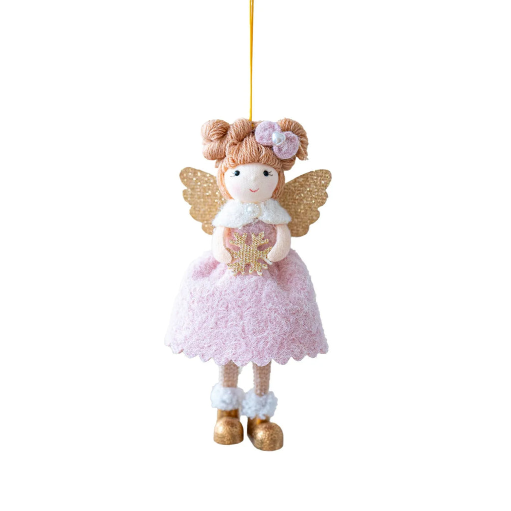 Soft pink cloth Christmas pendant ornament shaped like angel wings on a green branch.