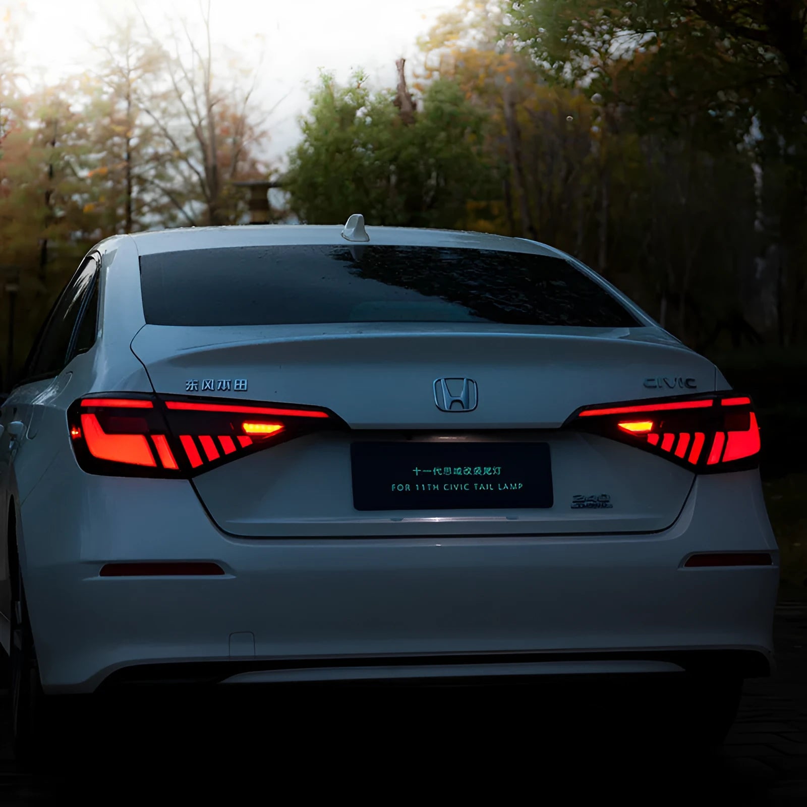 11th Generation Honda Civic black and red LED taillight assembly with streamer indicators.