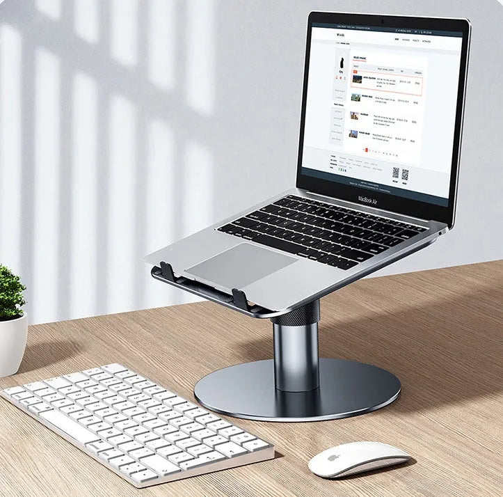 Silver aluminium car laptop stand with adjustable height and a 360-degree rotating base on a car seat.