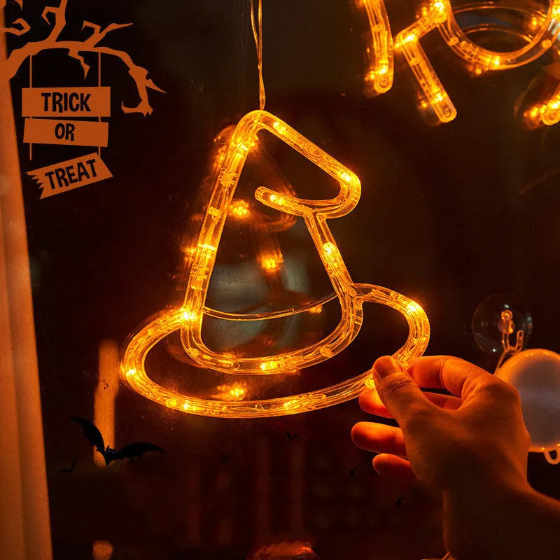 Set of seven Halloween LED hanging lights with spider, pumpkin, and ghost designs for window decoration