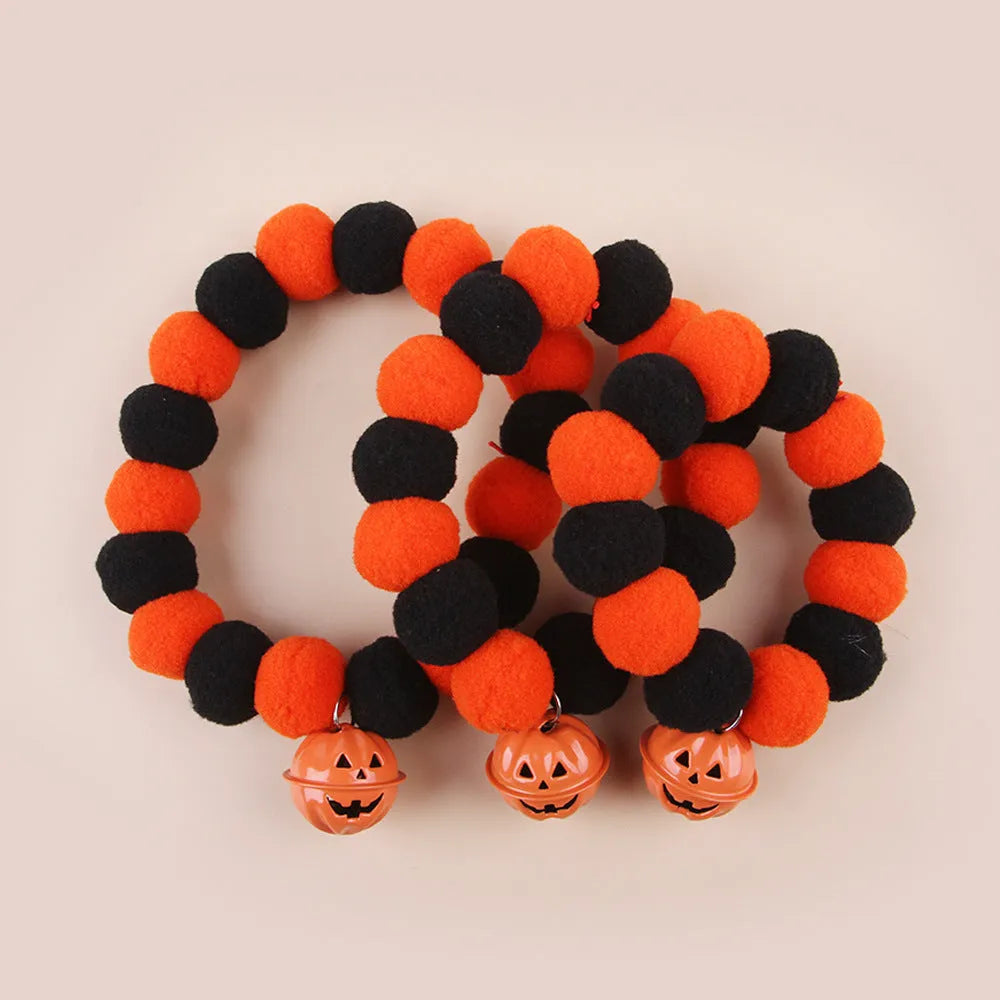 Funny orange pumpkin design cat collar with black details and an adjustable plastic buckle.