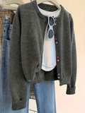 Dark grey women's button-front cardigan sweater with long sleeves for office wear