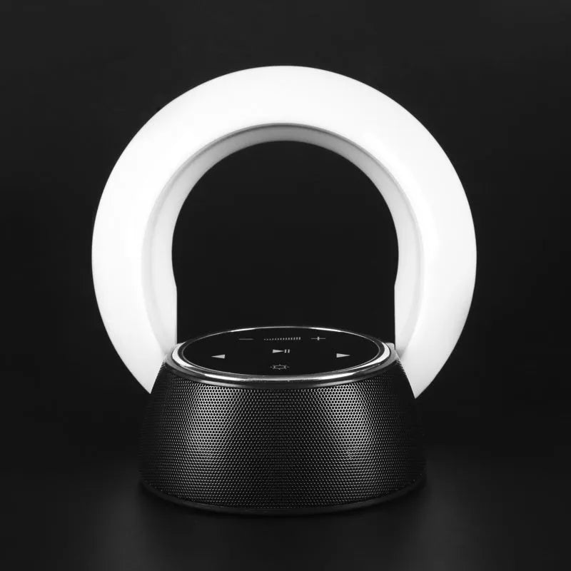 Blue Bluetooth desk lamp with speaker, shown folded, with touch controls on a white base.