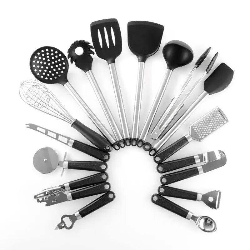 Black silicone kitchen utensil set of 16 pieces including spatulas and spoons on a countertop