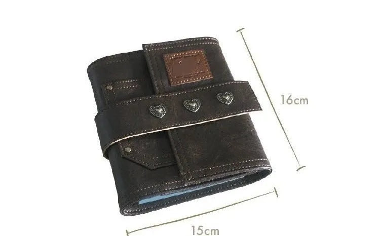 Brown A7 notebook with retro leather buckle closure showing loose-leaf binding