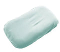 Beige portable cotton baby nest crib for infants on a neutral background.