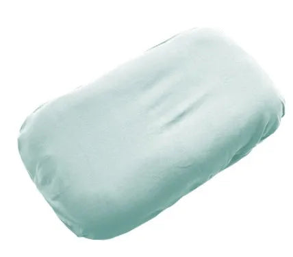 Beige portable cotton baby nest crib for infants on a neutral background.
