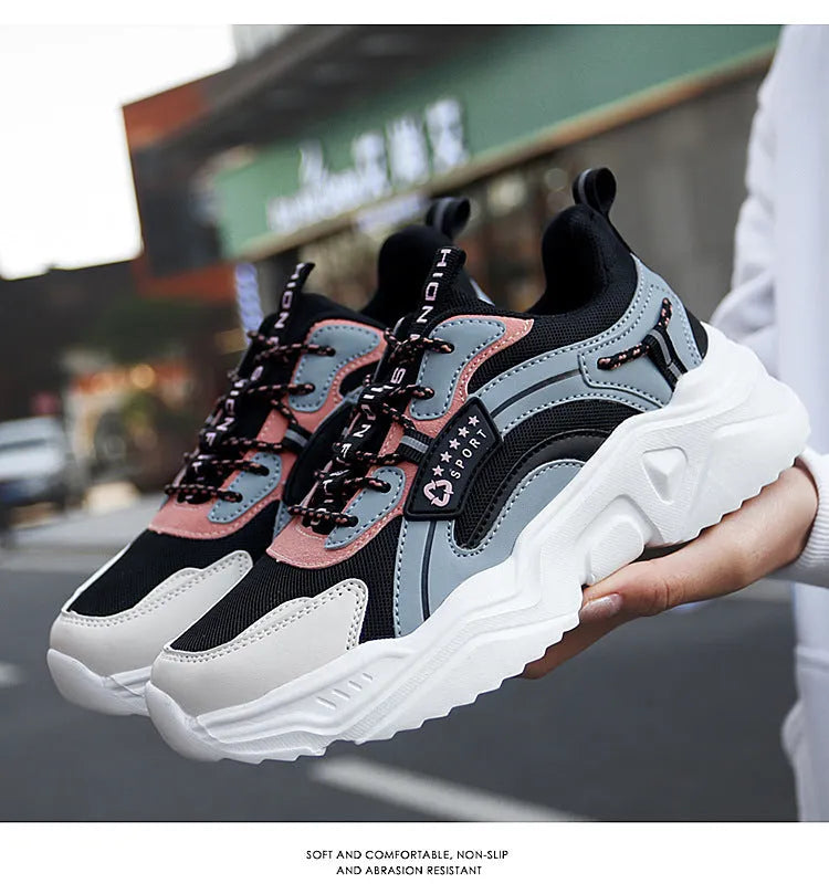 Women's white and black casual mesh sports shoes with a thick PU sole and buckle.