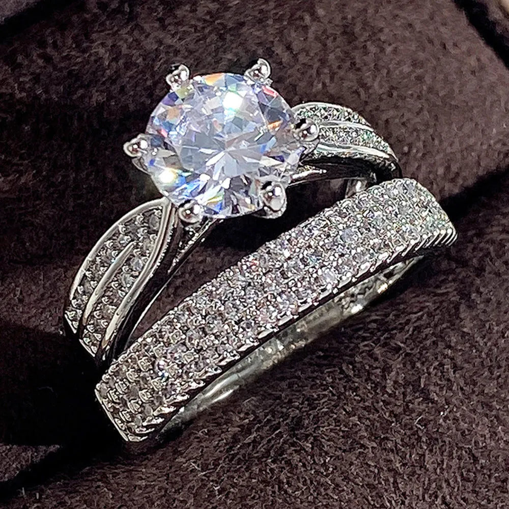 Geometric white gold colour wedding ring bracelet with round detail, shown in size options 5 to 11