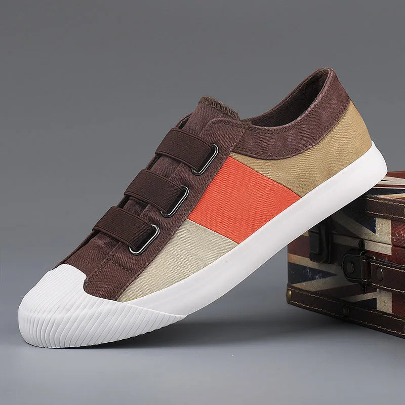 Men's low-top canvas sneakers in beige with elastic band closure and vulcanised rubber sole.