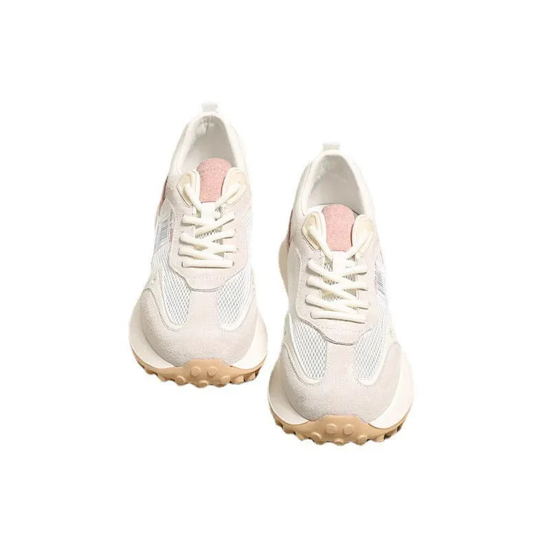 Women's grey retro low-top sneaker with round toe and flat rubber sole on a neutral background.