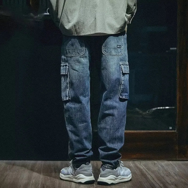 Man wearing blue loose straight-leg retro style stretch denim casual trousers