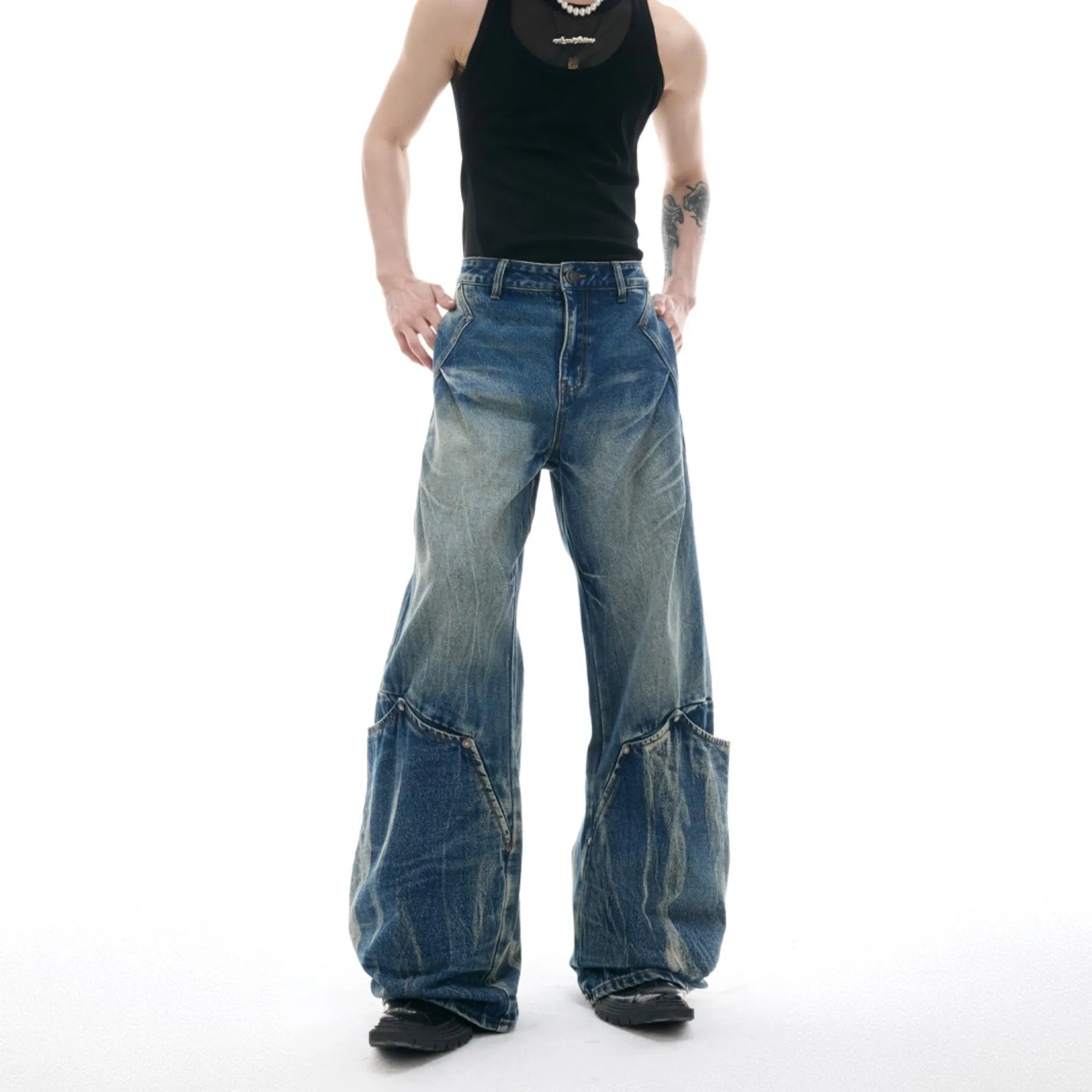 Men's retro washed burst pattern jeans in verdant blue with loose fit and curved knife style.