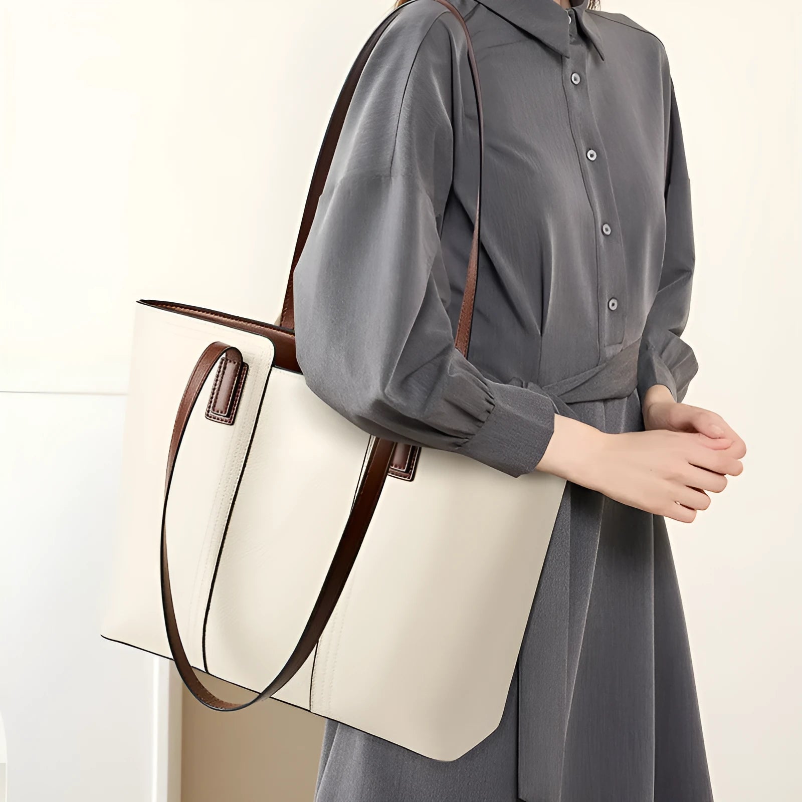 Women's black genuine cowhide leather commuter shoulder bag with horizontal square shape and multiple internal compartments