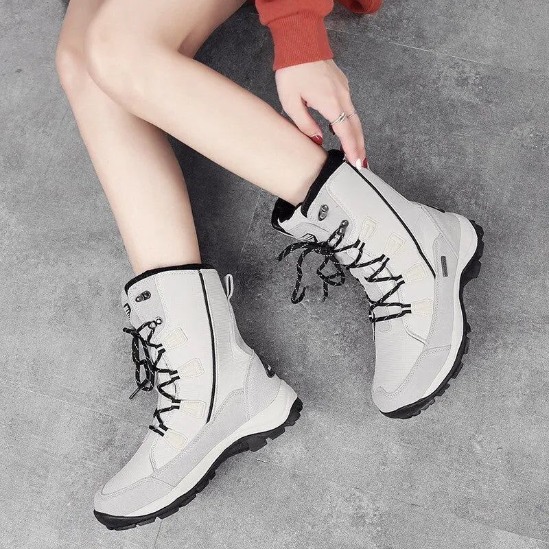Women's black genuine leather mid-calf snow boots with round toe and rubber sole