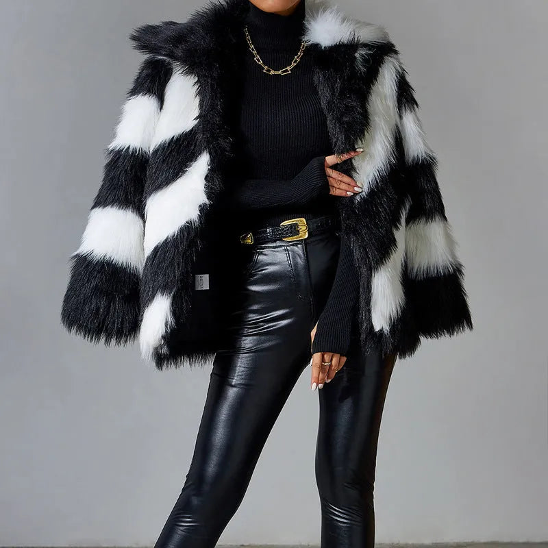 Women's faux fur coat with a contrasting colour lapel and a large fur collar.
