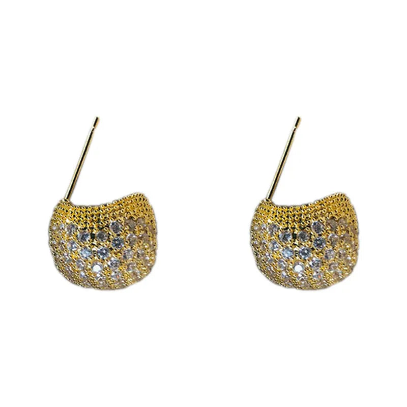 Gold and white drop-shaped geometric earrings with sphere elements and sparkling crystals