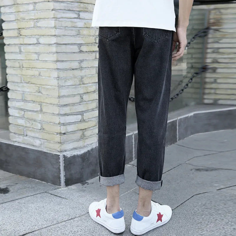 Men's straight-leg cotton jeans in black and blue colours showing loose fit design