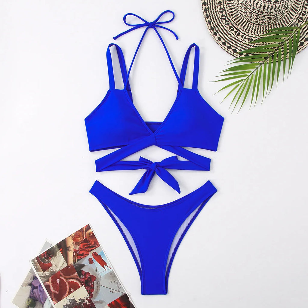 Women's solid colour bikini swimsuit with adjustable ties on the triangle top and brief bottoms.