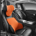 Black memory foam car lumbar support pillow and matching headrest with knitted fabric.